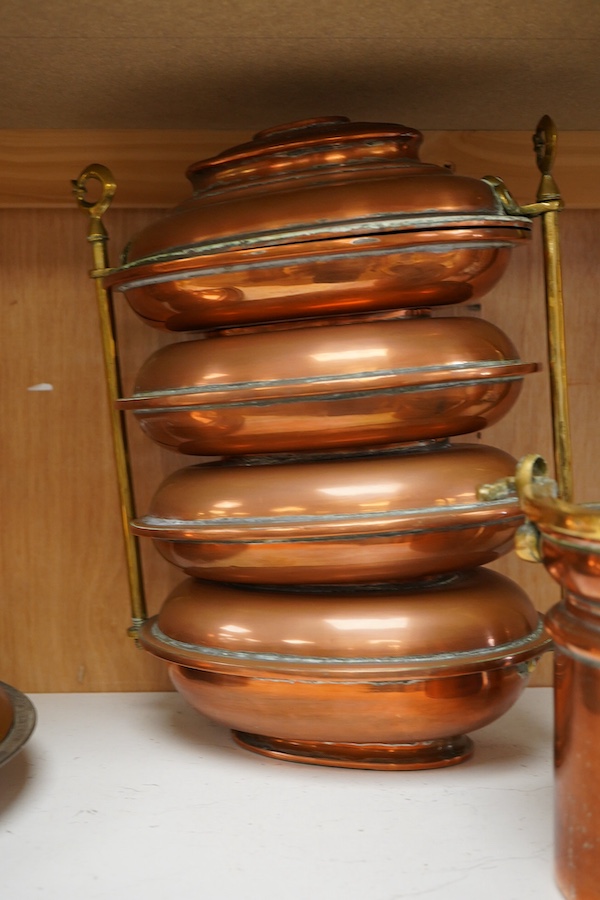 Copper vessels and a brass handled jug and bucket, largest 33cm high